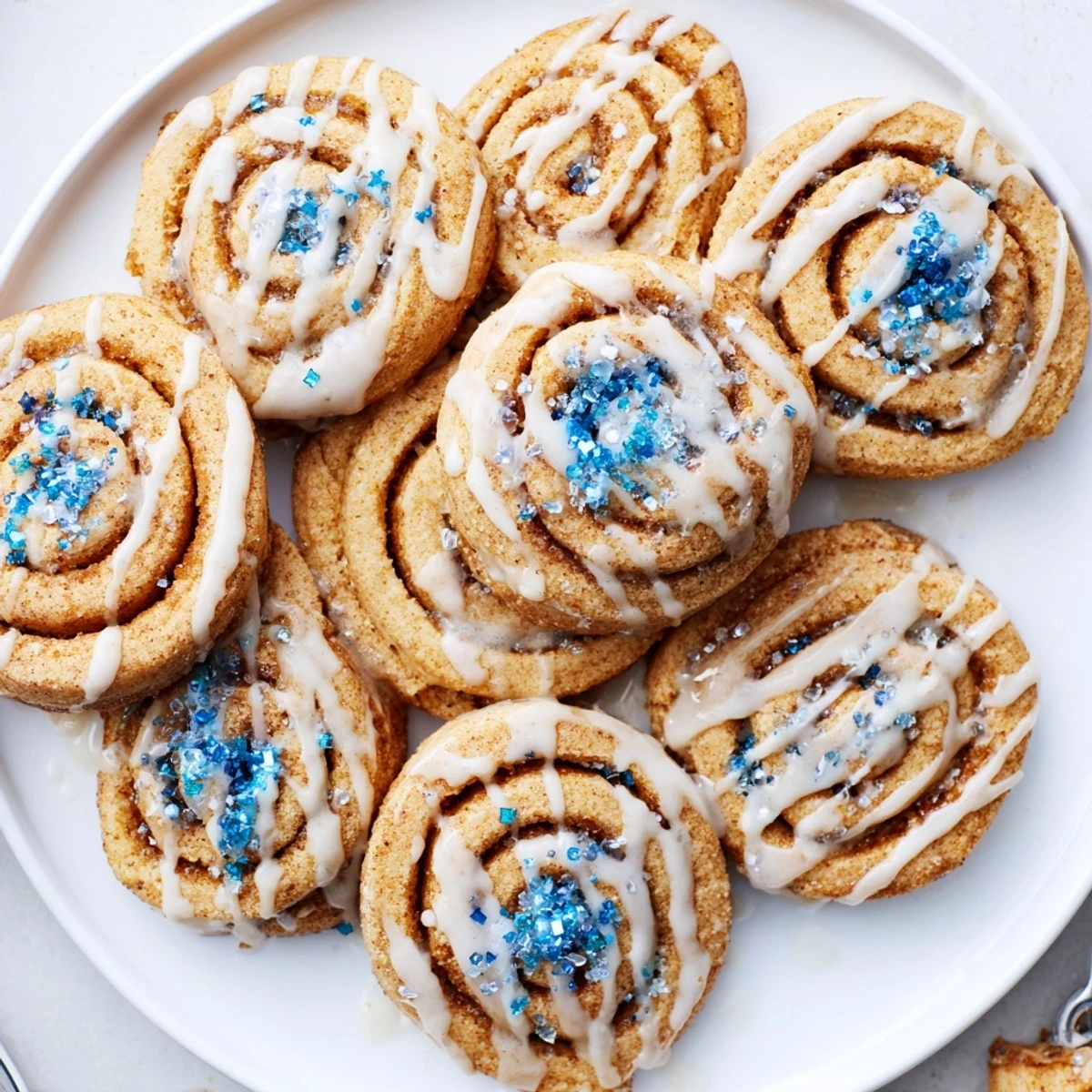 Soft Gingerbread Hanukkah Cinnamon Roll Cookies drizzled with sweet vanilla glaze.  