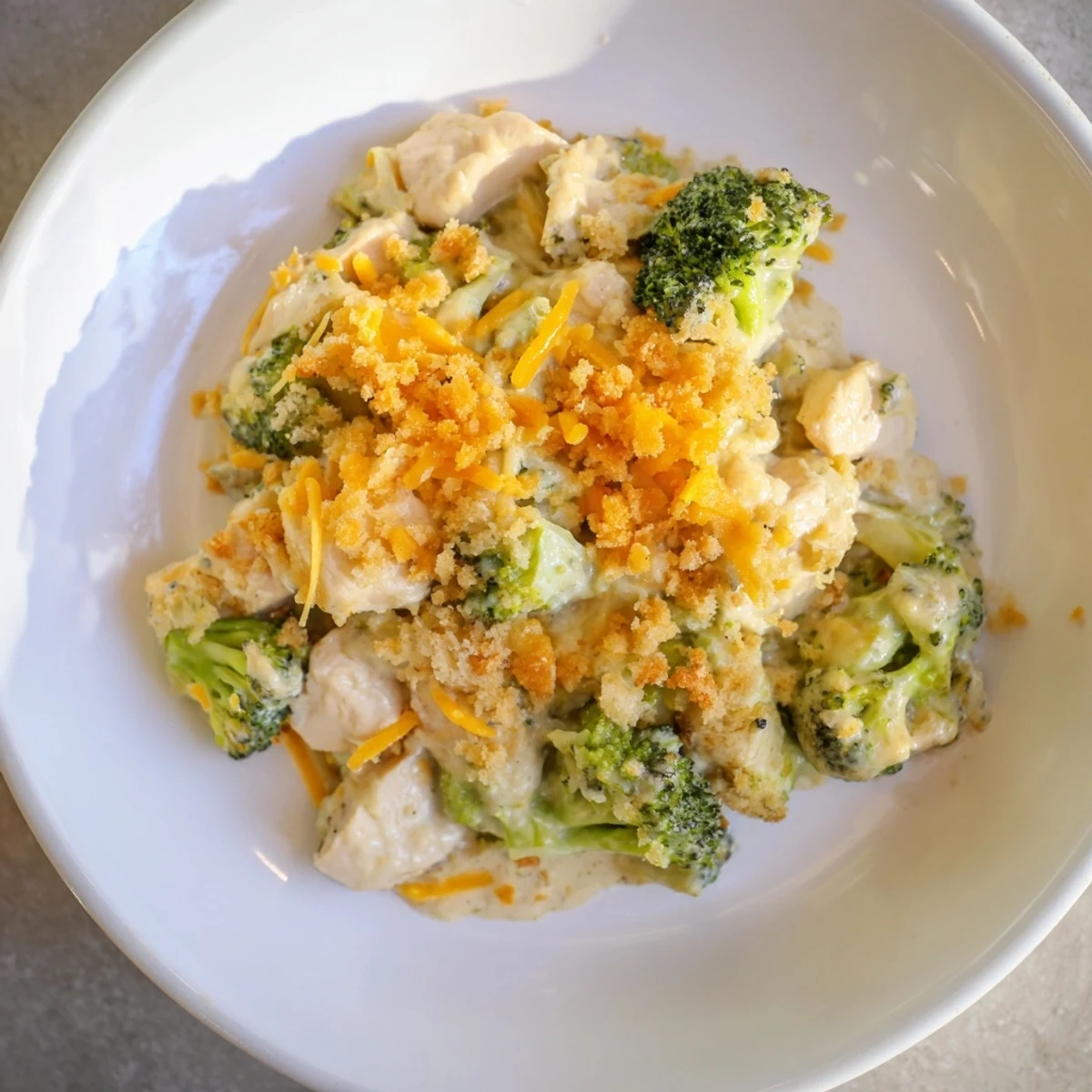Enjoy this comforting Cheddar Broccoli Chicken Bake, bubbling hot, a perfect, family-friendly dinner option.