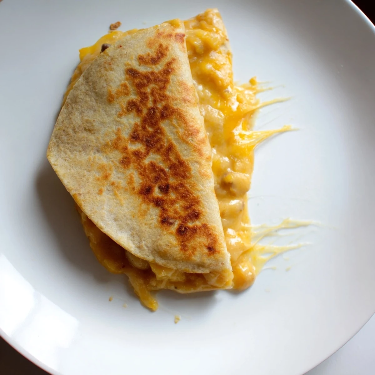 Golden-crisped bean and cheese quesadillas, filled with melted cheese and served with fresh salsa.
