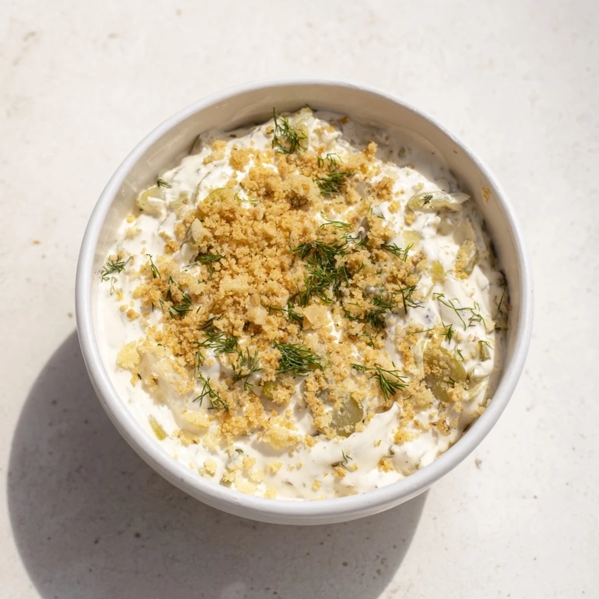 Creamy Fried Pickle Dip, ready to serve with crunchy chips, offering a tangy appetizer experience.