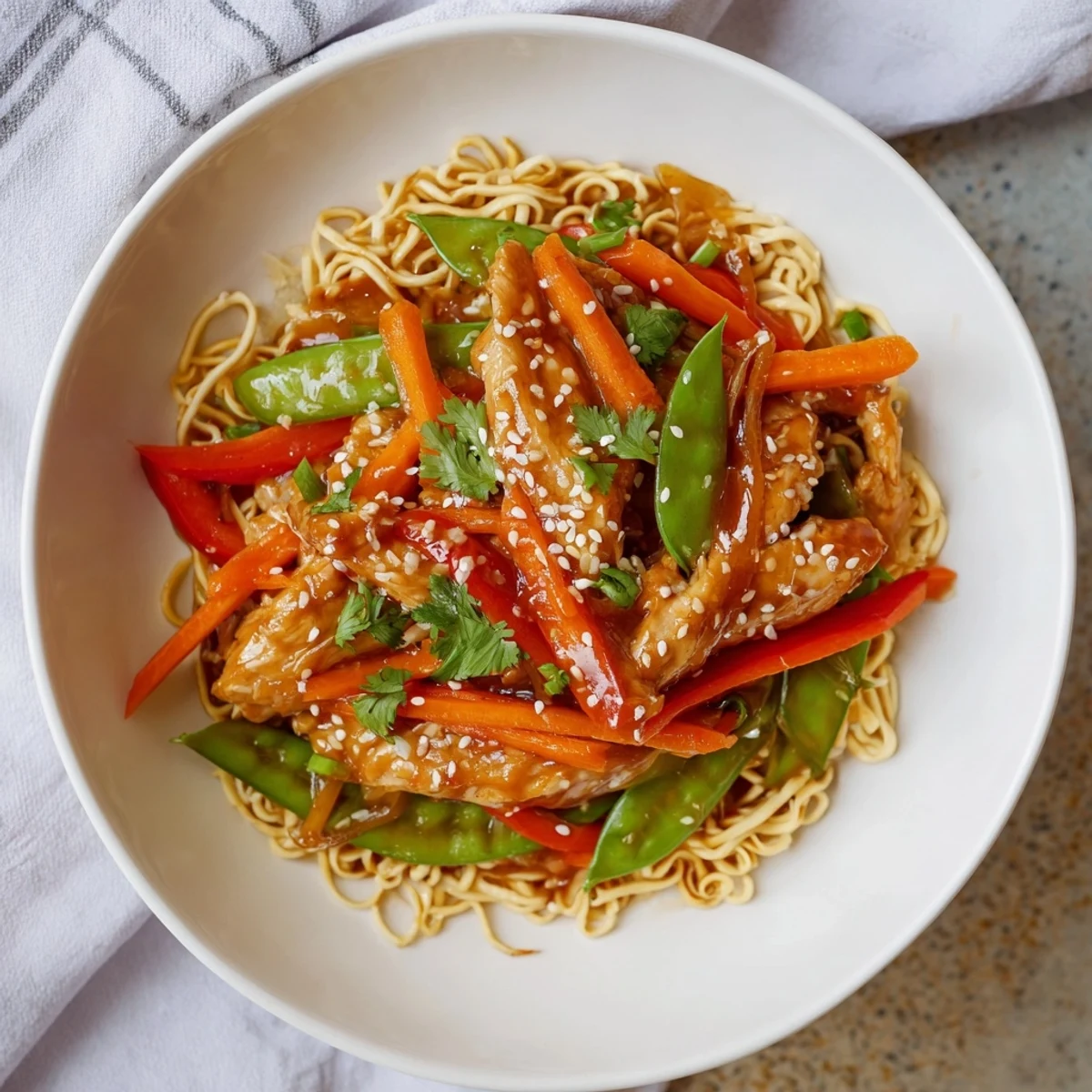 Image of Lemon-Garlic Chicken Stir Fry with Noodles, a flavorful dish with bright veggies.