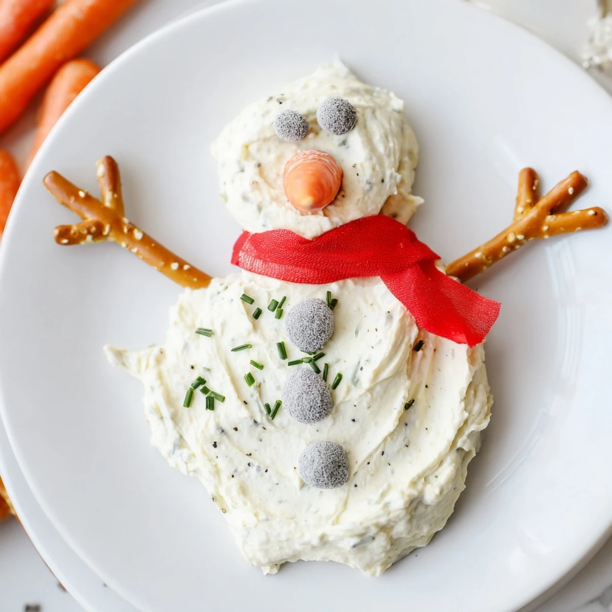 Bright and fun, this Melted Snowman Dip features crunchy pretzels for arms, ready to dip.