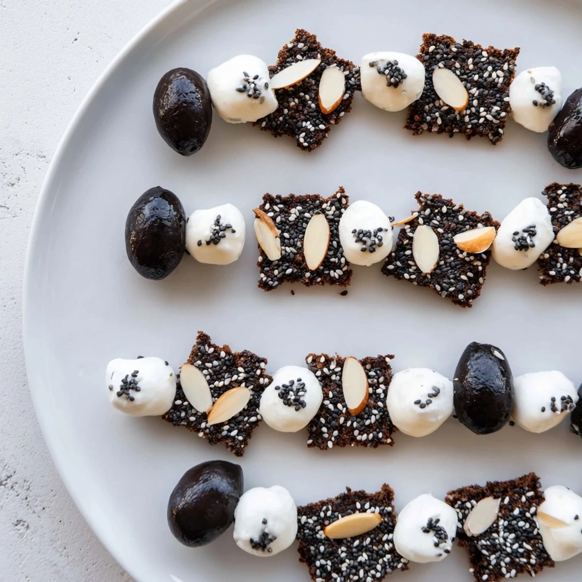 Fresh mozzarella and olives in a Black and White Formal Affair create an inviting visual appetizer spread.