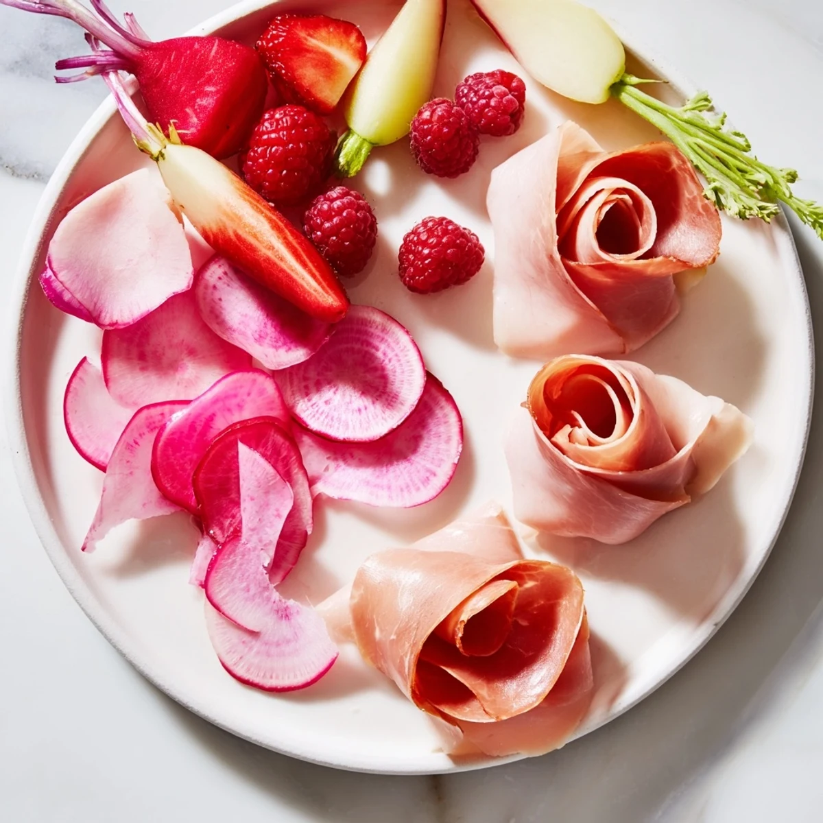Elegant Pink Petal Watercolor Wash platter, showcasing a vibrant array of cheeses, fruit, and charcuterie for a gathering.