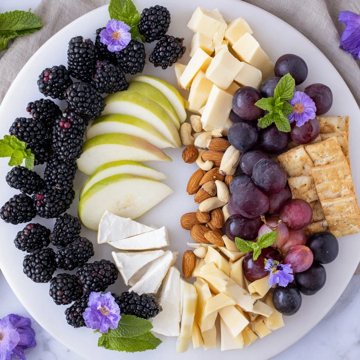 A harmonious Yin-Yang Balance cheese board showcasing fresh fruit, creamy cheeses, and crunchy crackers for a perfect spread.
