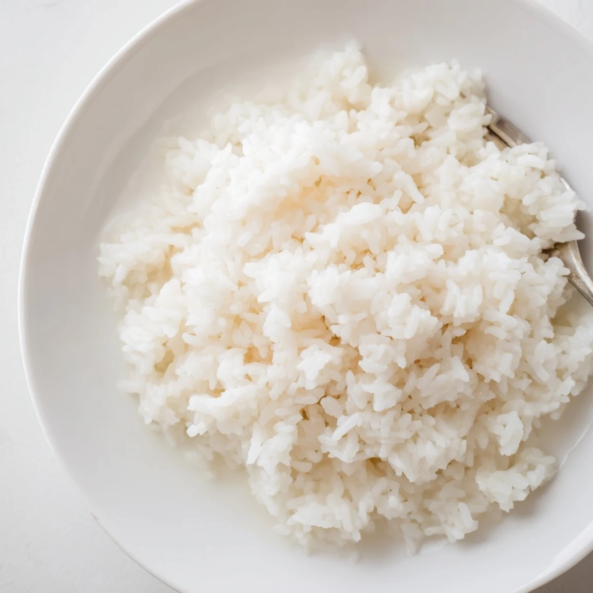 Enjoy a close-up of the delicious coconut jasmine rice, a creamy, easy side dish delight.