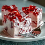 A light, jiggly Strawberry Rose Gelatin Mosaic Cake ready for a festive party.