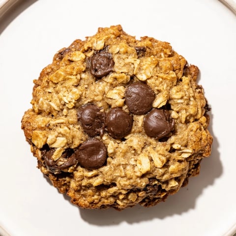 Warm and inviting image of Oat-Banana Chocolate Chip Cookies, golden-brown and ready to eat.