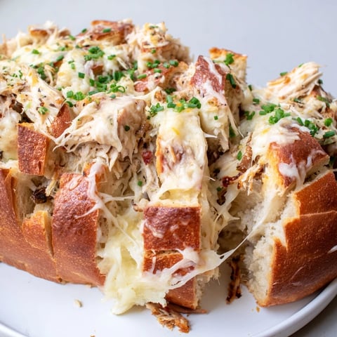 Golden, bubbly Cheesy Leftover Chicken Bake Pull-Apart Bread with perfectly melted cheese and tender chicken.