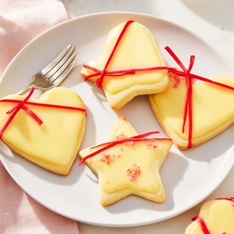 Delicate Mignonneries Coeurs et Étoiles Rubans cookies, heart and star shapes, iced then tied with silk ribbon.