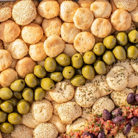 Cobblestone Courtyard appetizer: A beautiful platter of crackers and olives arranged to mimic cobblestones.