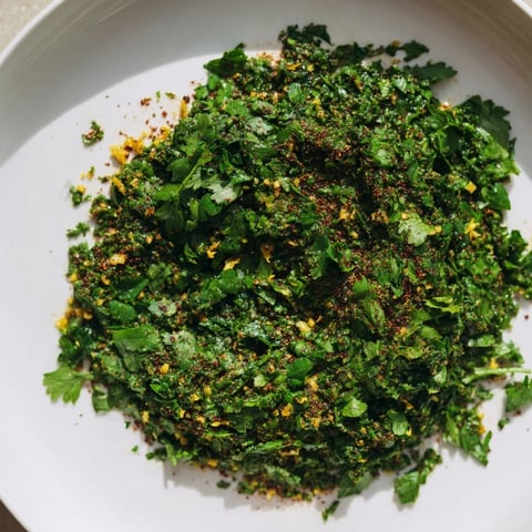 Vibrant Moroccan Chermoula Marinade, showcasing a bright citrusy paste with herbs and spices ready to coat fish.