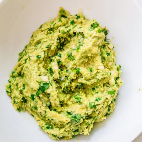Creamy, vibrant avocado lime dip, perfect for dipping tortilla chips or crudités with friends.