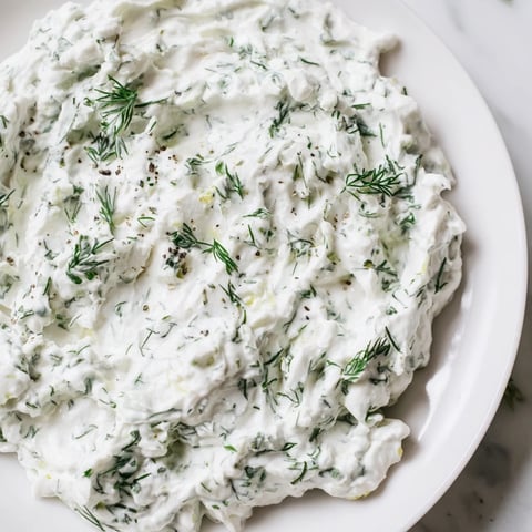 Creamy Greek Yogurt Herb Dip with fresh herbs, ready for dipping vegetables, crisp and cool.