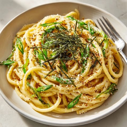 Golden Miso Butter Bucatini, tossed with sauce and seaweed; a delicious Japanese-Italian fusion dinner.