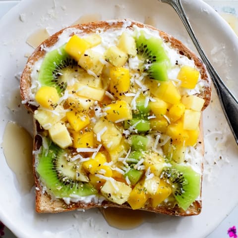 Delicious yogurt-custard toast bursting with fresh mango, pineapple, and kiwi flavor.  