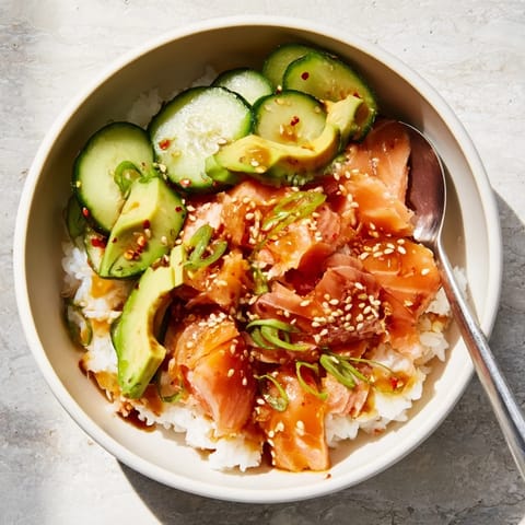 Quick and easy leftover salmon and rice bowl, drizzled with sesame oil and soy sauce.  