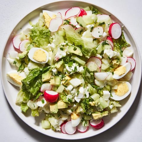 This creamy Green Goddess Chopped Egg Salad combines fresh herbs with chopped eggs for a delicious recipe.