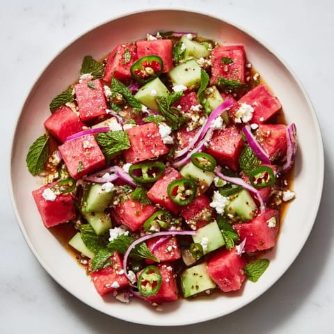 Cool, refreshing image of a Cucumber and Watermelon Hot Girl Salad bursting with color, ideal for summer meals.