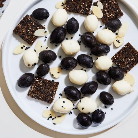 An elegant Black and White Formal Affair appetizer showcasing contrasting black and white ingredients for sophisticated tastes.