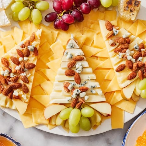Elegant Art Deco Arch Cheese Platter, showcasing Gruyère and cheddar, ready to be enjoyed.