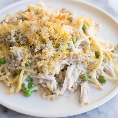 A delicious, creamy Turkey or Chicken Tetrazzini, featuring tender chicken and a crispy parmesan topping.