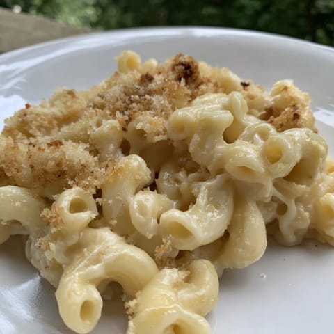 A close-up of creamy mac and cheese: rich, cheesy goodness perfect for a hearty, satisfying meal.