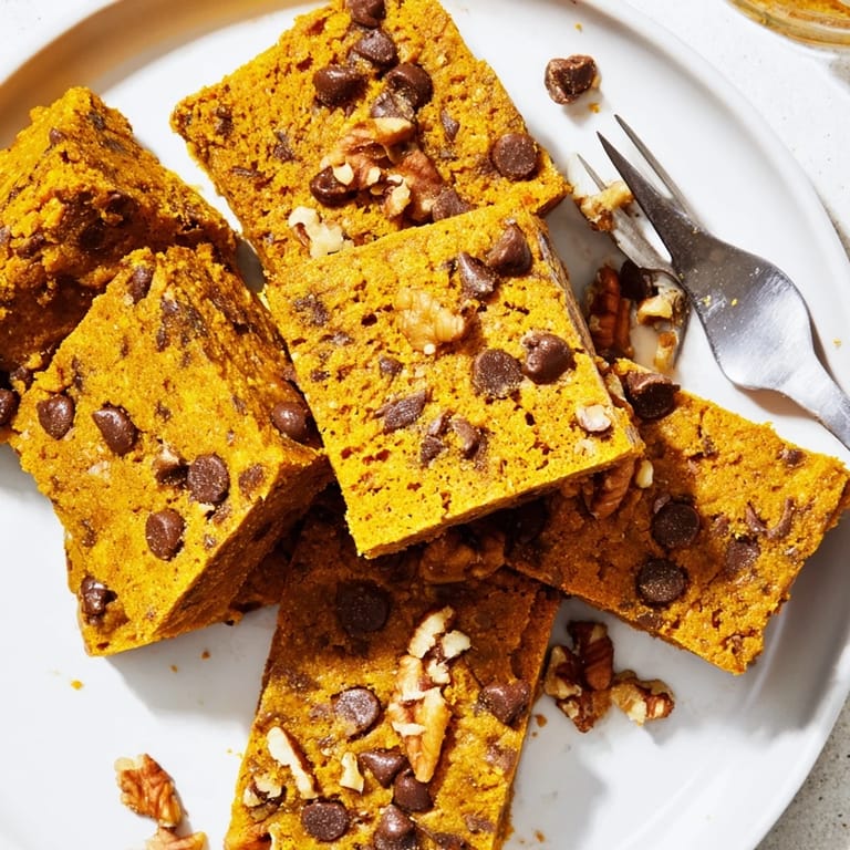 Warmly spiced pumpkin bars packed with protein, ideal for post-workout snacking.  