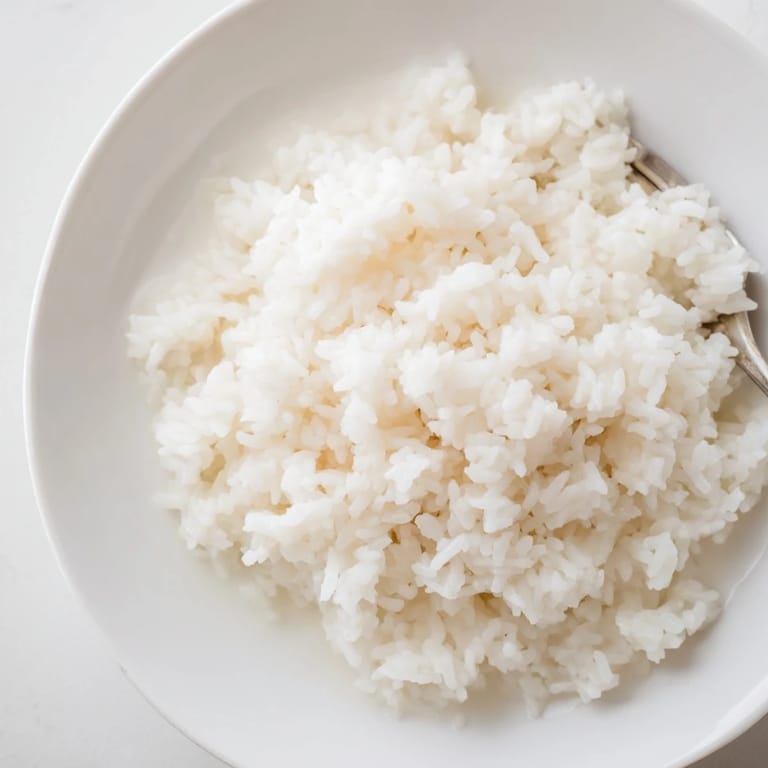 Enjoy a close-up of the delicious coconut jasmine rice, a creamy, easy side dish delight.